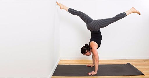 woman doing handstand