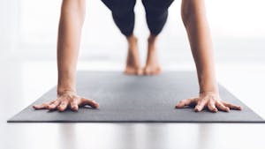practicing yoga on a yoga mat